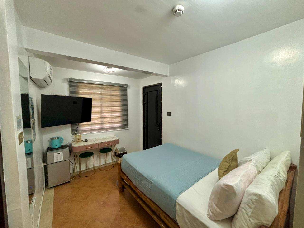 bed with a tv in the room