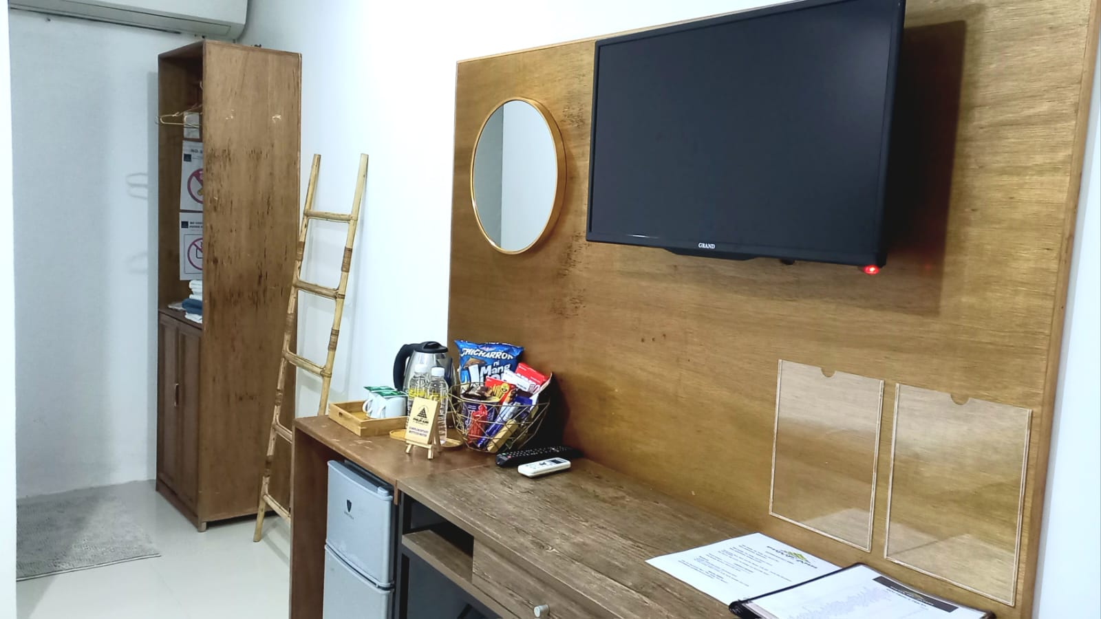 desk with a tv attached on the wall